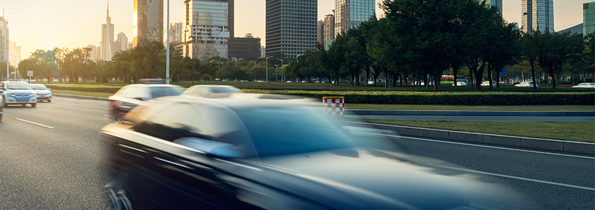 Cars Traveling blurred cityscape